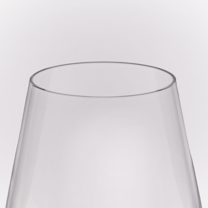Close-up of a clear glass vessel, likely a wine glass or vase, showing the top rim and tapered transparent body against a light gray background.