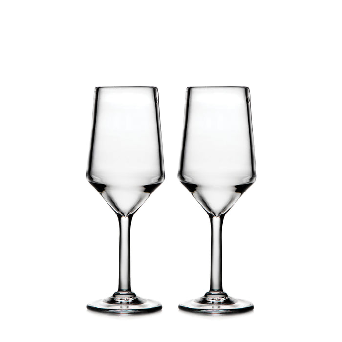 Two clear wine glasses with tapered bowls and stems on a white background.
