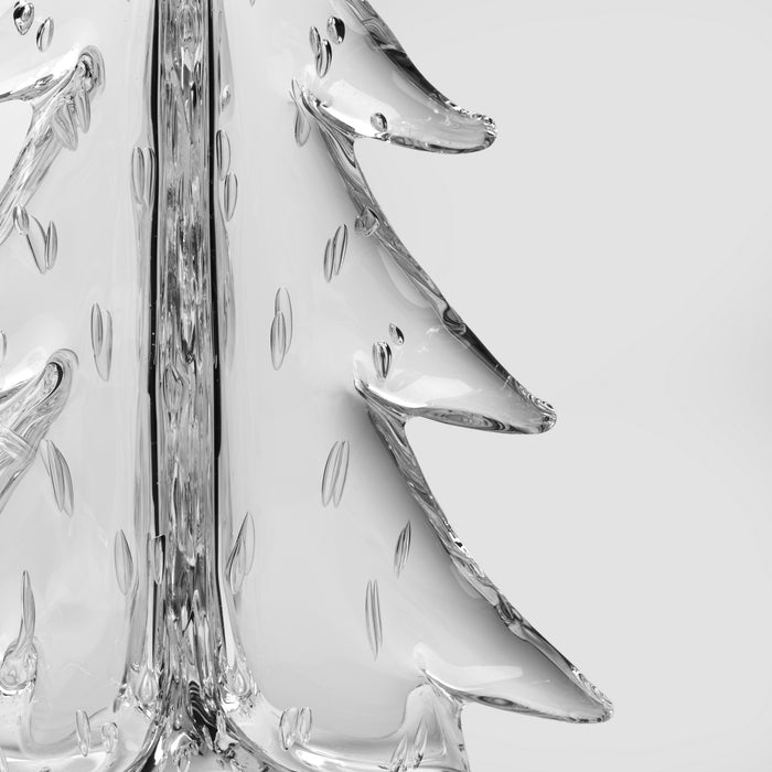 Clear glass tree-shaped object with bubble detailing and branch-like projections extending from the sides.