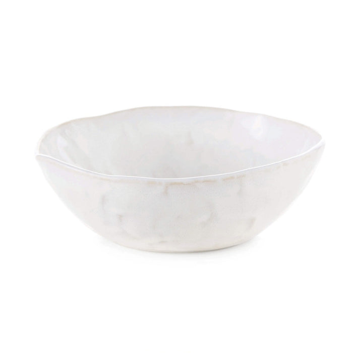 White cereal bowl with wavy rim and cloud-like surface texture.