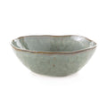 Moss green cereal bowl with wavy rim and speckled glaze finish.