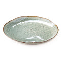 Moss green ceramic dinner plate with rustic brown rim and mottled glaze finish.