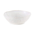 White ceramic bowl with wavy rim and subtle cloud-like pattern throughout.