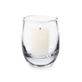 Clear glass hurricane vase with cream-colored pillar candle inside.