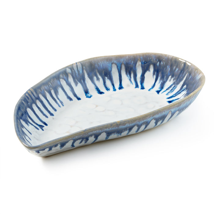 Oval ceramic bowl with blue and white striped pattern and textured mussel shell-shaped design.
