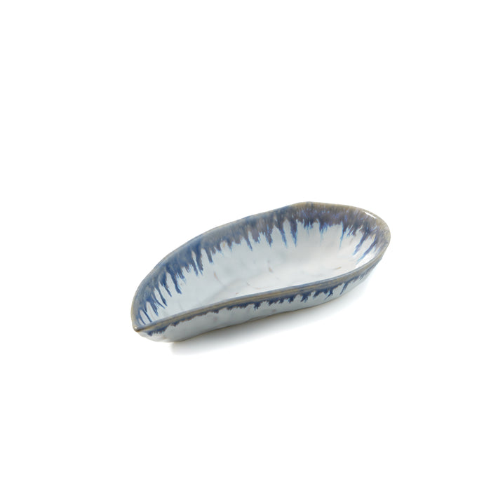 Small mussel shell-shaped ceramic bowl in white with blue brush stroke pattern.