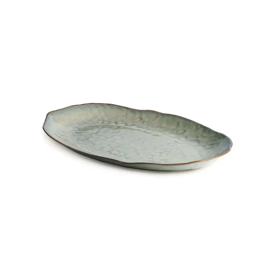 Large oval platter with moss green glaze and mottled surface finish.