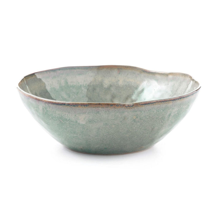 Moss green ceramic pasta bowl with organic wavy rim and mottled glaze finish.