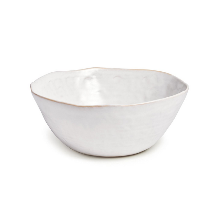 White ceramic serving bowl with a curved rim and natural edge finish.