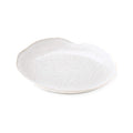 White ceramic side plate with curved rim and subtle textured surface.