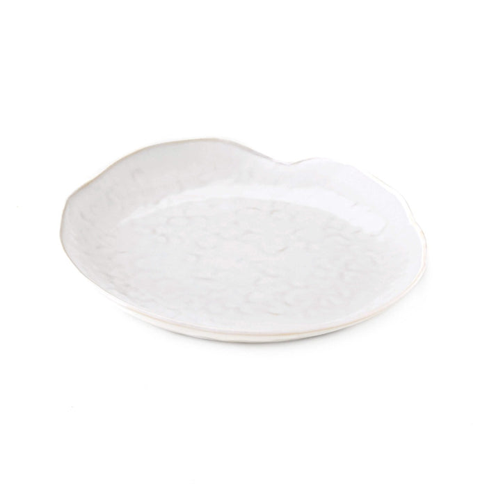 White ceramic side plate with curved rim and subtle textured surface.