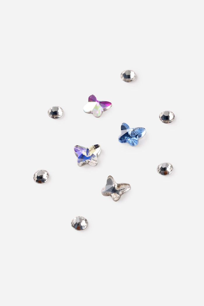 Butterfly Glam DIY Tooth Gem Kit features iridescent and blue butterfly-shaped crystals alongside silver round gems.