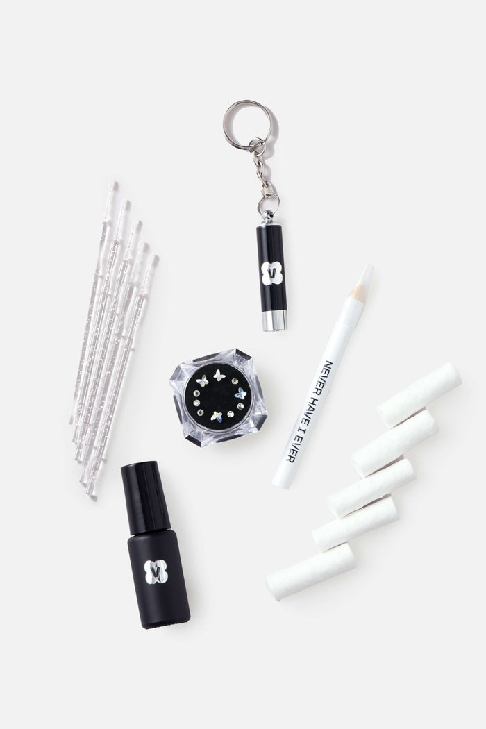 Butterfly Glam DIY Tooth Gem Kit with applicator brushes, glue, crystals, UV light, pencil, and cotton rolls.