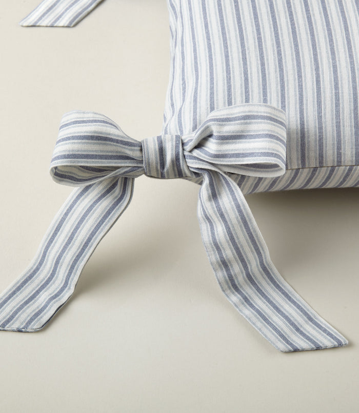 Detail of ribbon ties on the Windsor Stripe Oblong Pillow in Wedgewood
