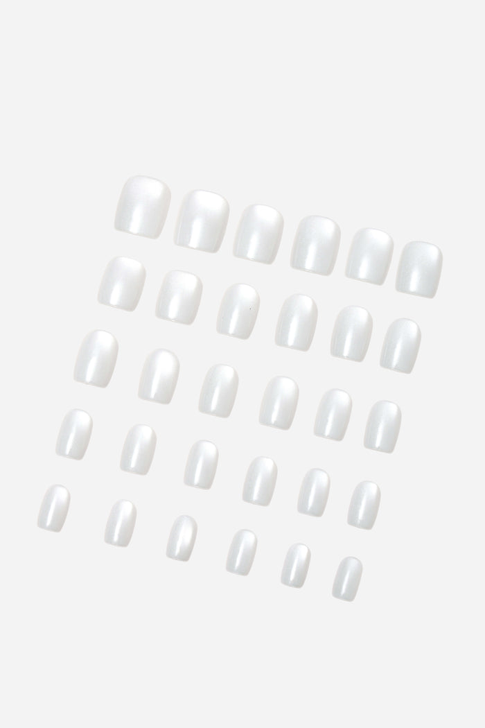 Set of clean, glossy white square press-on nails with a pearlescent finish.