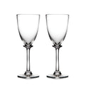 Two clear wine glasses with long stems and rounded bowls on white background.