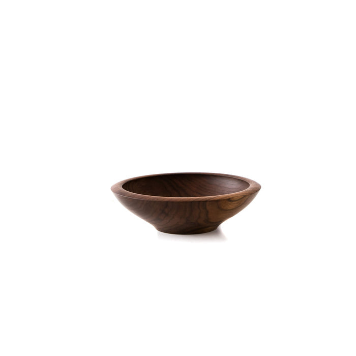 Dark brown wooden bowl with wide shallow curved sides and a rolled rim.