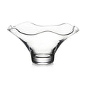 Clear glass bowl with wavy fluted rim and pedestal base on white background.