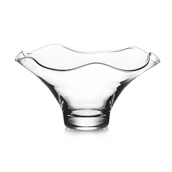 Clear glass bowl with wavy fluted rim and pedestal base on white background.