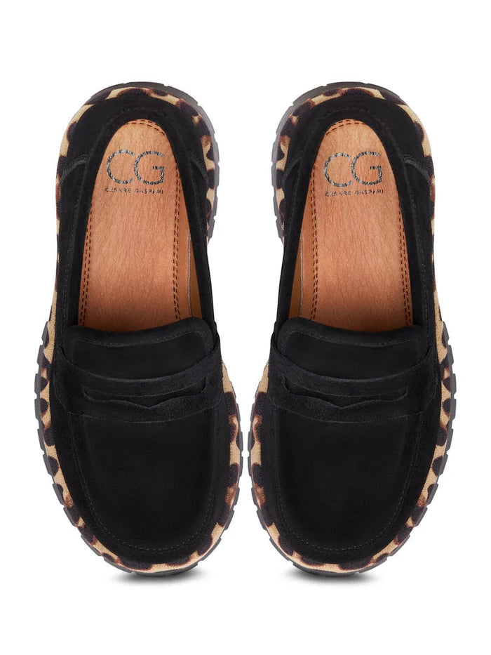 A trendy pair of Lily black loafers with a chunky sole, perfect for adding a chic and fashionable touch to any outfit.