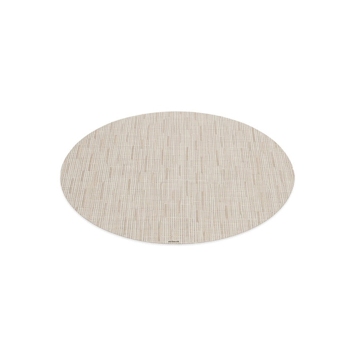 Oval placemat with tan woven bamboo texture and vertical striping pattern.