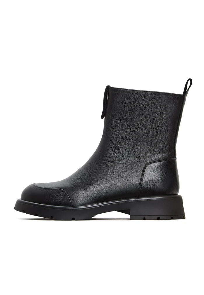 A stylish pair of chunky ankle boots in black, the Wool Penelope, ideal for women's footwear in winter fashion.