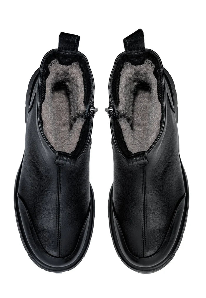 A stylish pair of black chunky ankle boots, the Wool Penelope, for women's winter fashion.