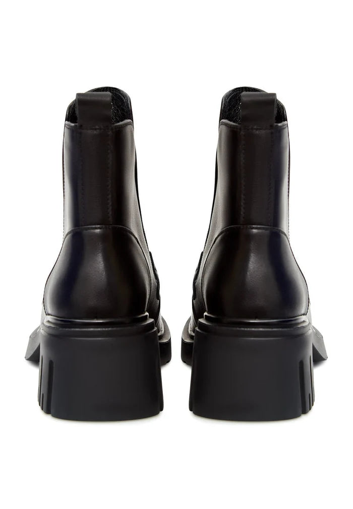 A chic pair of black chunky heel ankle boots with trendy chain details, perfect for a fashionable look.