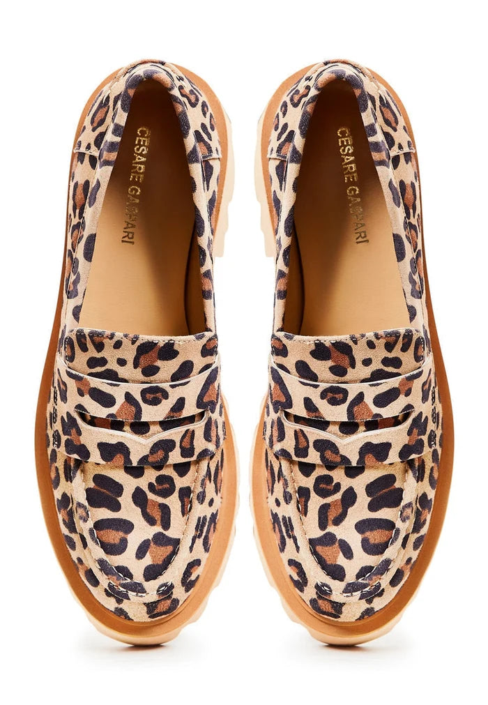 A pair of stylish chunky platform loafers in eye-catching leopard print, perfect for women wanting to make a bold statement with their footwear.