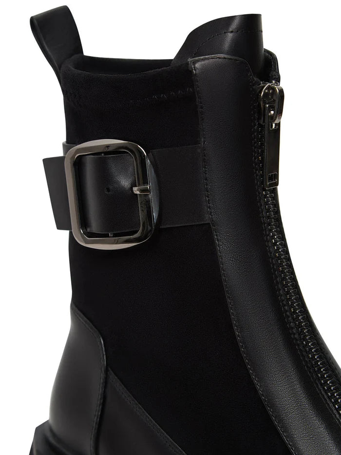A trendy pair of black Ciara ankle boots with chunky soles, perfect for anyone looking for stylish and edgy footwear.