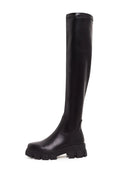 A pair of stylish black knee-high chunky sole Karlie fashion boots - the perfect statement footwear.