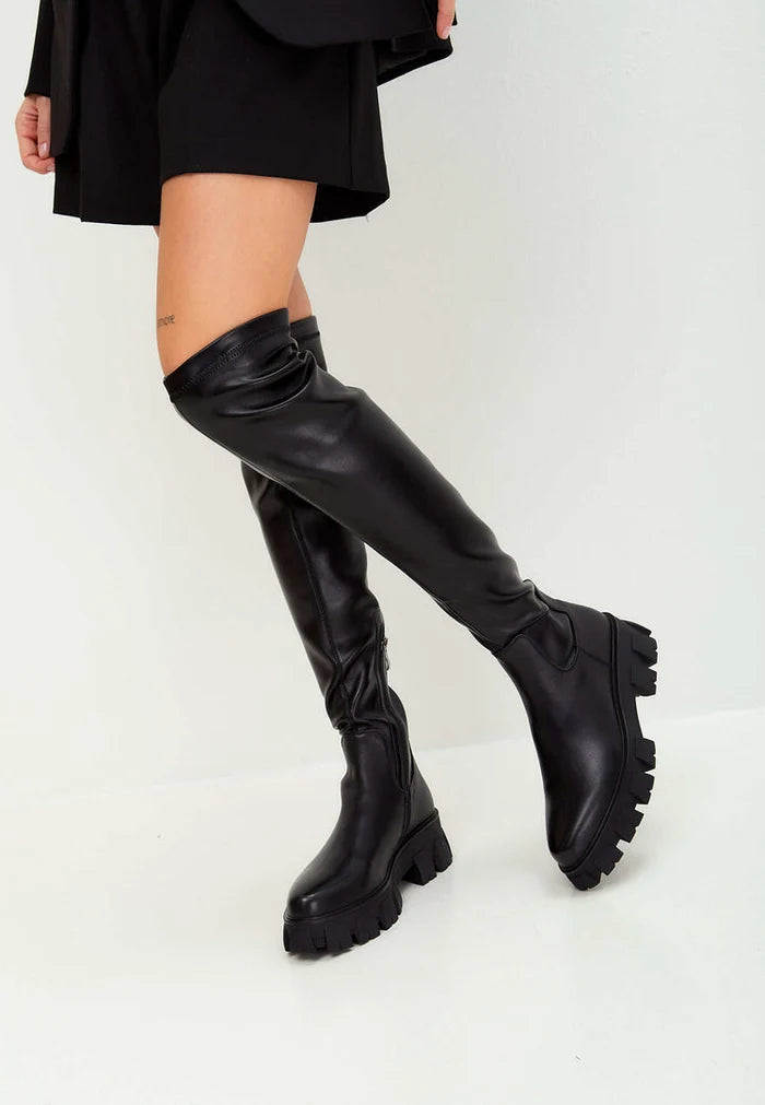 A stylish pair of knee-high chunky sole Karlie fashion black boots - the perfect choice for fashionable and trendy footwear.