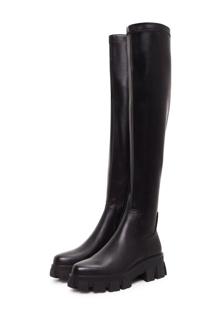 A pair of stylish knee-high Karlie fashion boots with chunky black soles - the perfect statement footwear.