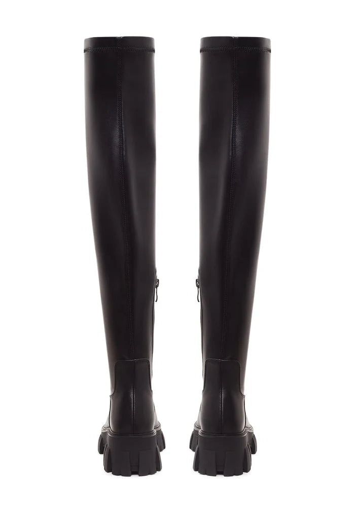A pair of stylish black Karlie knee-high boots with chunky soles, perfect for fashion-forward individuals looking for trendy and comfortable footwear.