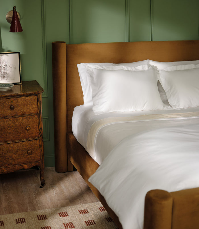 Clara duvet and sham set on velvet bed, White