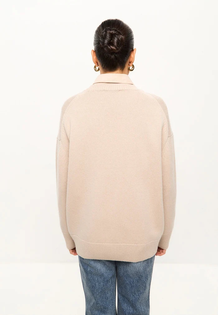 A chic women's classic crew neck beige sweater with a Mulan inspired design, perfect for staying cozy and stylish in the cold weather.