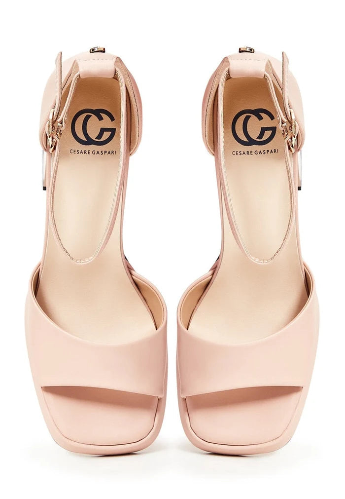 A stylish pair of beige open toe high heel sandals, perfect for any classic outfit.