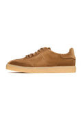 A stylish pair of retro-inspired brown suede sneakers, classic low-top style that are perfect for any occasion.
