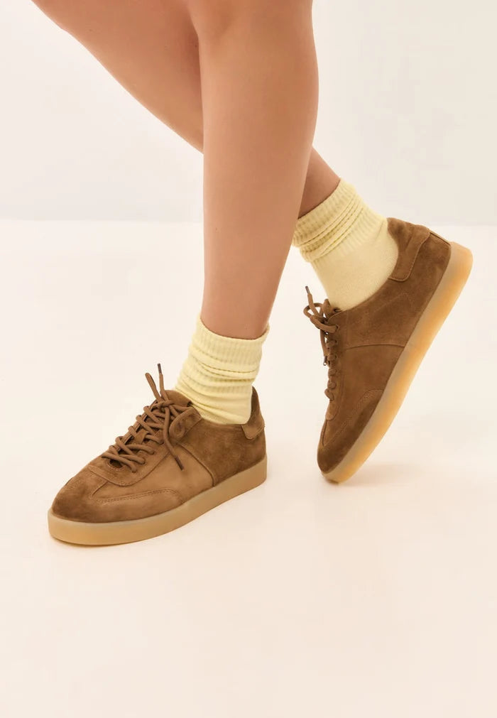 Stylish brown suede sneakers, a classic low-top silhouette inspired by retro design.