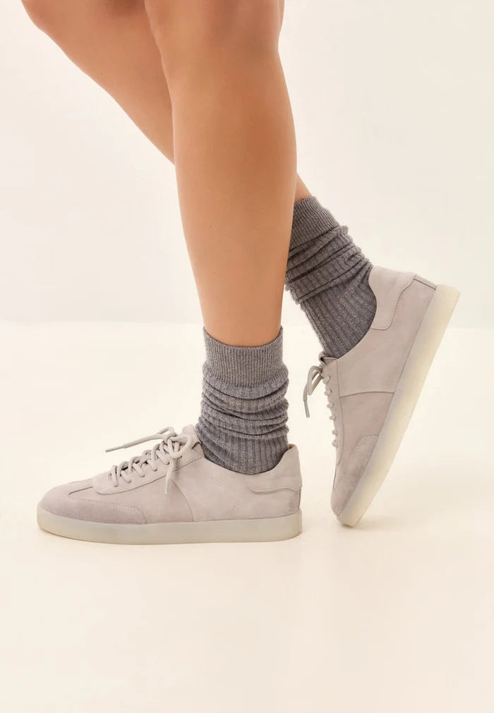 Stylish gray suede low-top sneakers - a classic pair of suede shoes, perfect for any casual outfit.