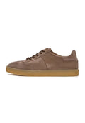 A stylish pair of classic beige suede low-top sneakers perfect for casual footwear fashion.
