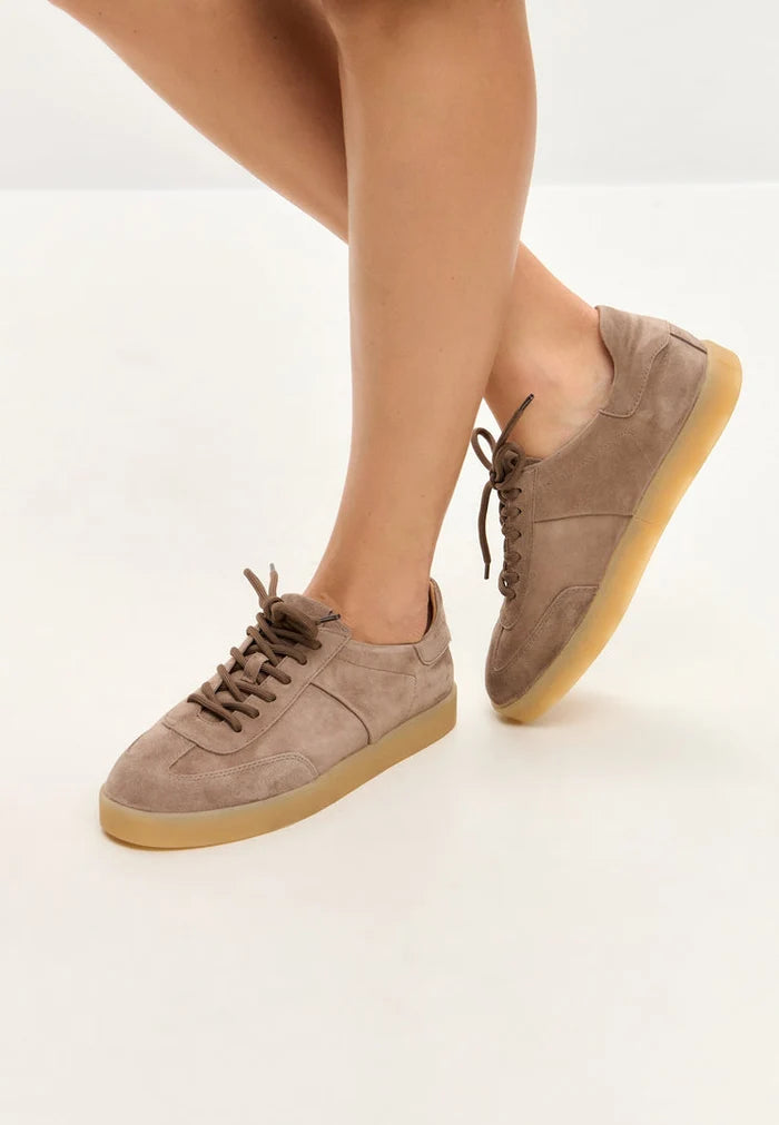 A pair of stylish beige suede low-top sneakers, a classic addition to your footwear fashion collection.