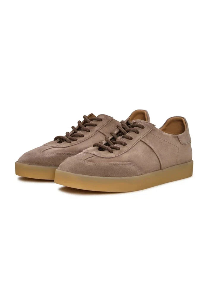 A pair of stylish low-top classic beige suede sneakers, perfect for footwear fashion enthusiasts.