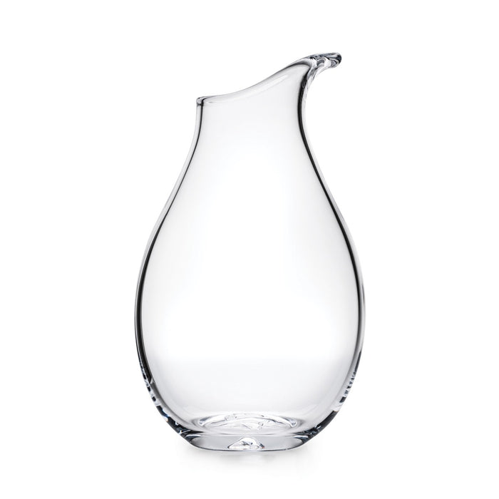 Clear glass carafe with curved teardrop shape and angled pouring spout.