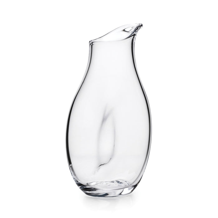Clear glass carafe with curved body and angled pouring spout, featuring a twisted handle.