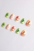 Cute press-on nails with cooking bear, food, and vegetable designs.