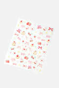 Sheet of coquette cutie nail stickers featuring strawberries, hearts, cakes, and bows in pink and red.