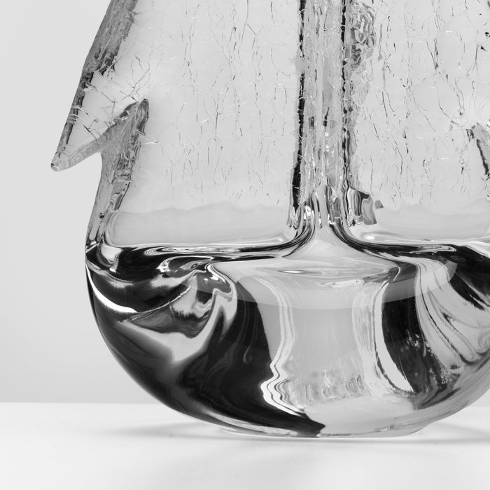 Clear glass candle with crackle texture and black swirled base design.