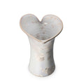 Clear crystalline vase with calla lily-shaped opening and embossed circular pattern throughout body.
