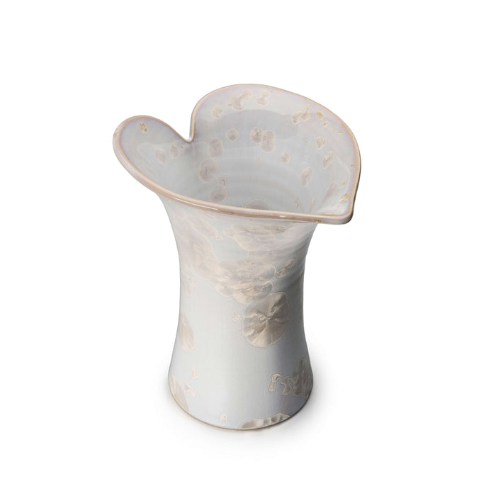 Translucent white cylindrical vase with flared calla lily-shaped rim and embossed floral pattern.